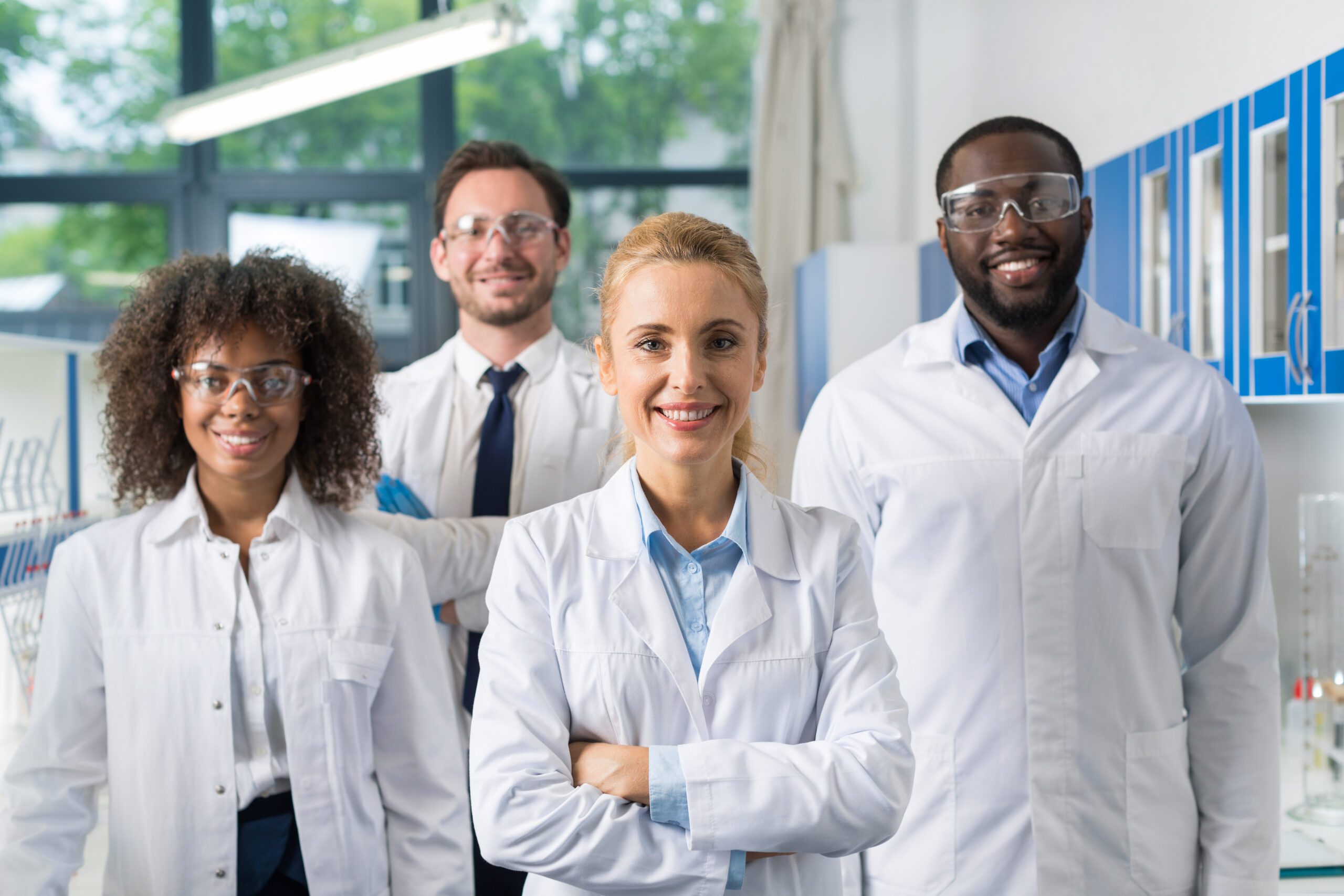 Image, Smiling Group Of Scientists In Modern Laboratory With Female Leader, Mix Race Team Of Scientific Researchers In Lab